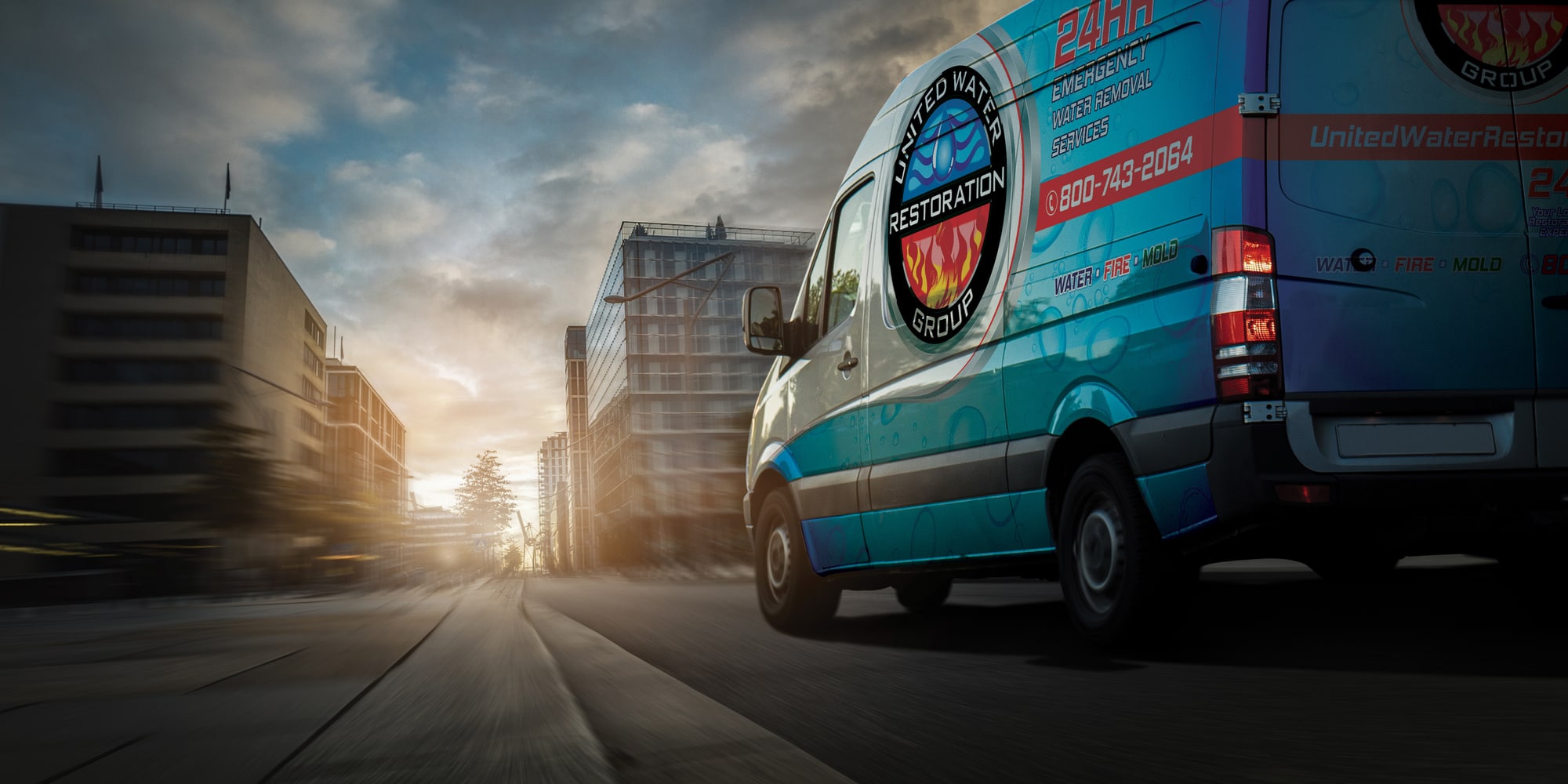 A United Water Restoration Group of Staten Island van heading out on an emergency call at sunset